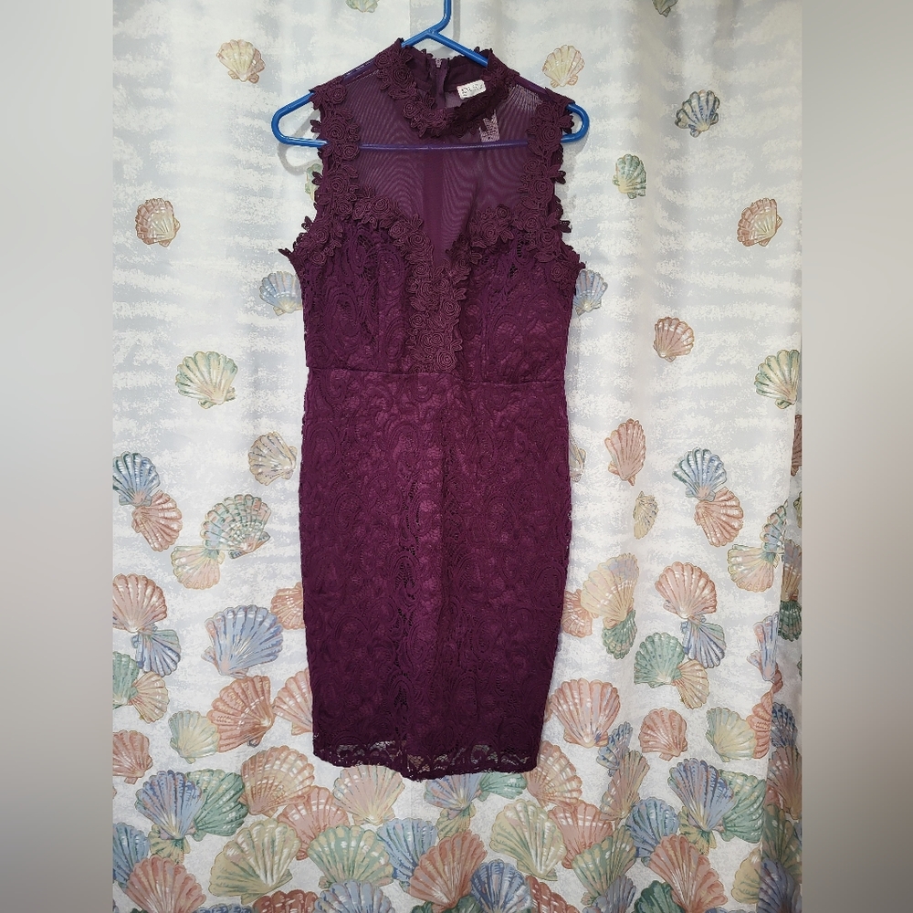 Beautiful Love Fast Live Hard lacy plum dress. With a choke collar.